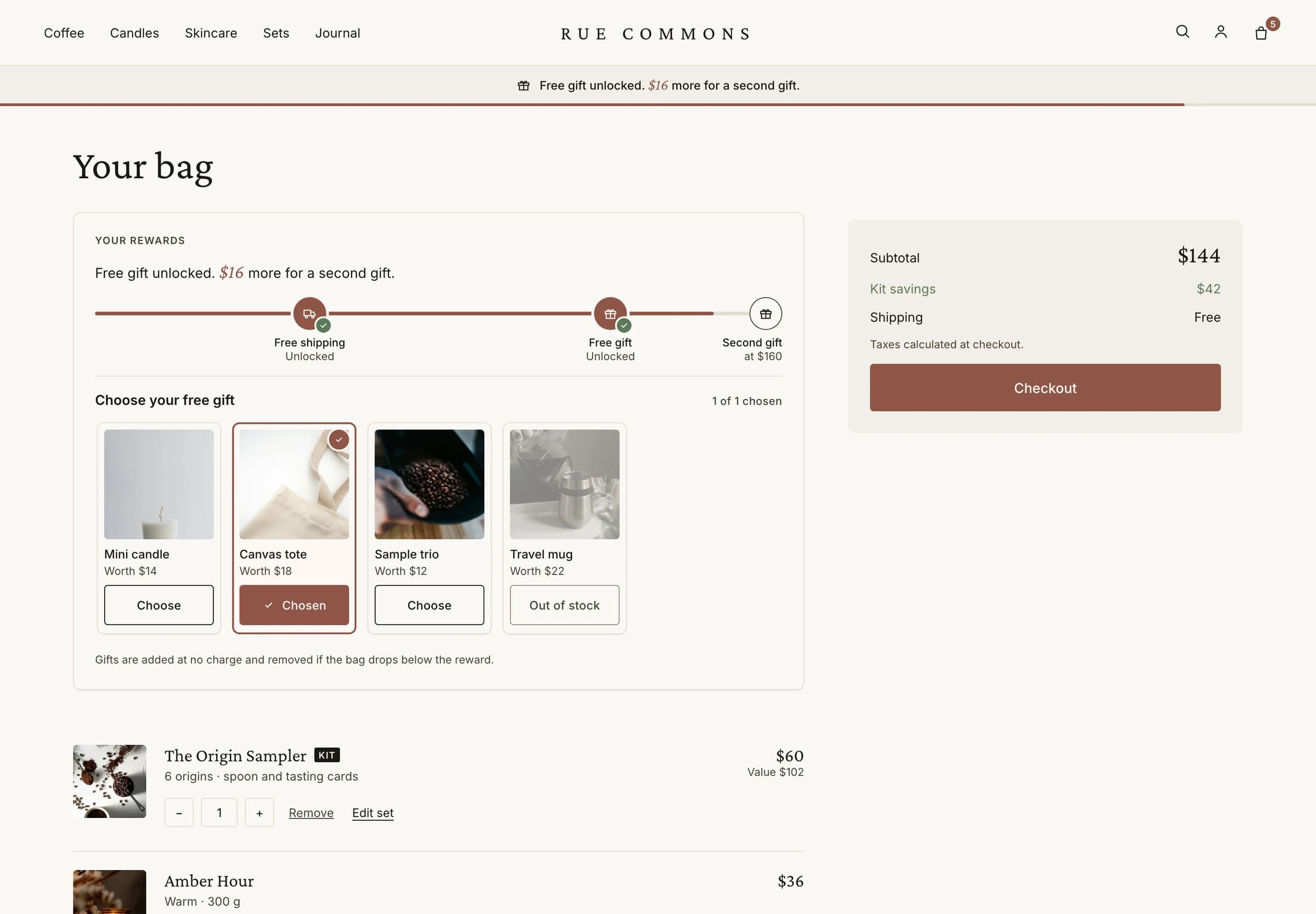 A bag page with a rewards bar showing free shipping and a free gift unlocked, and four gifts to choose from.