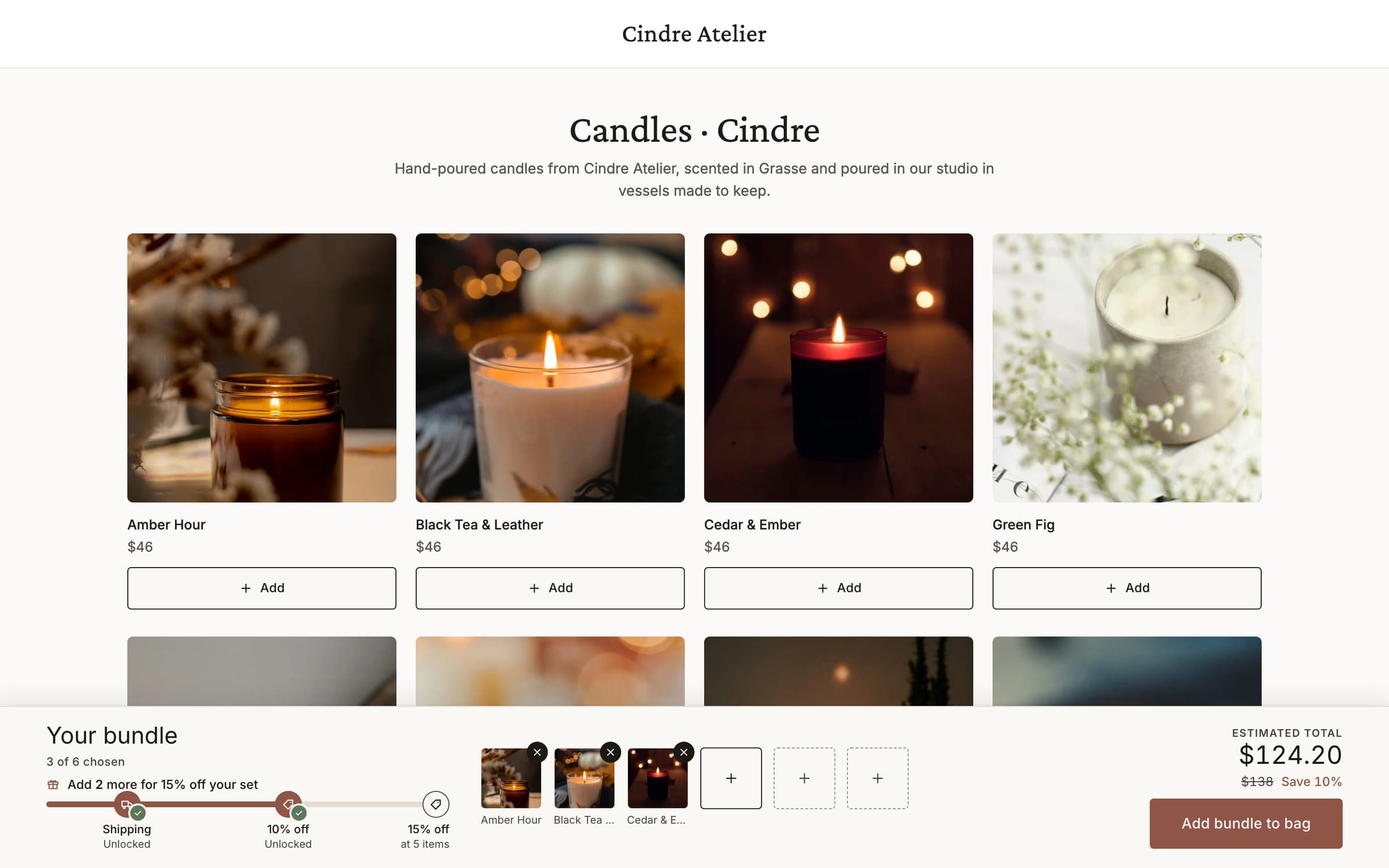 The Cindre Atelier collection page on the demo store with three candles in the tray and the tier progress bar at 10% off.