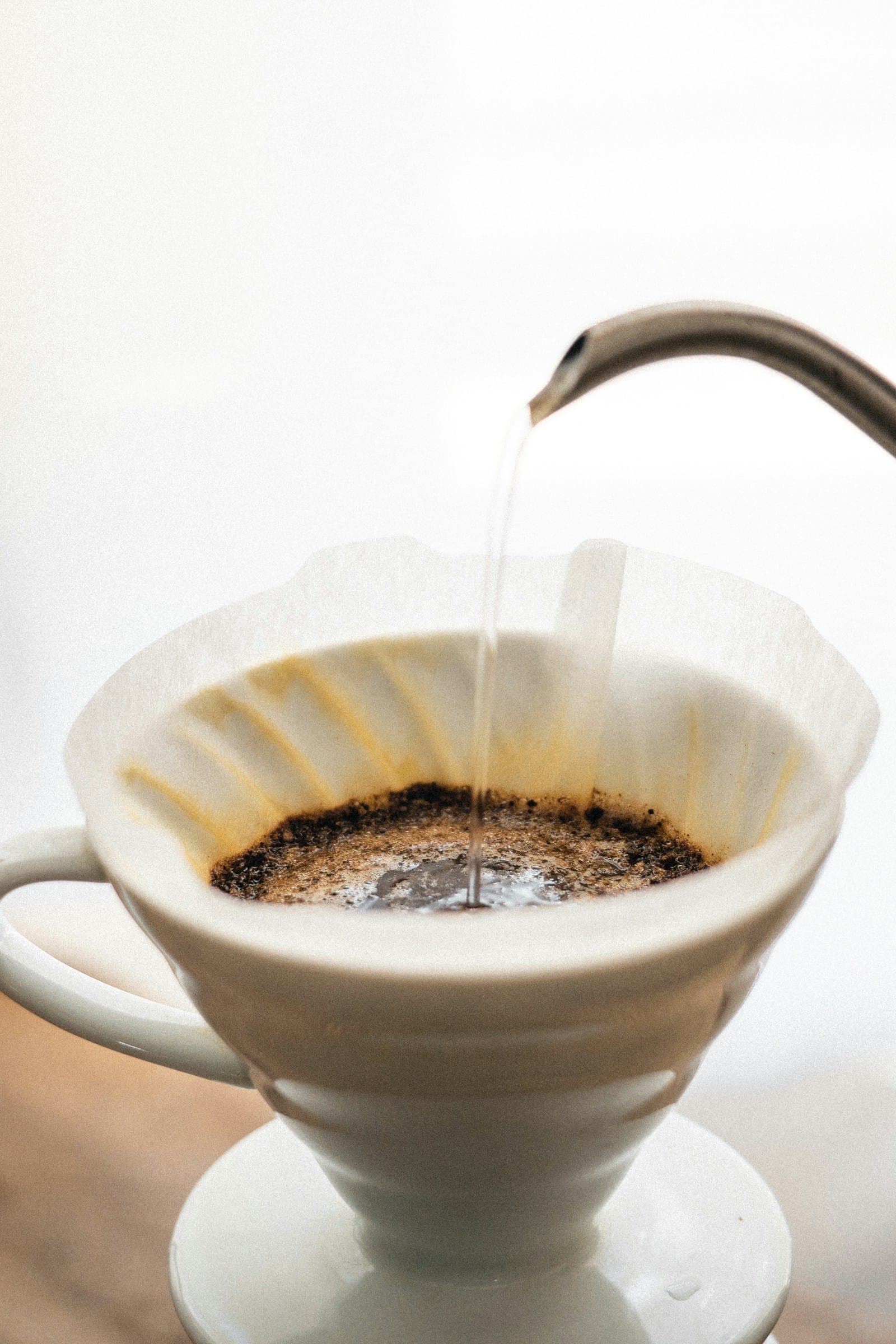 White ceramic dripper over a cup