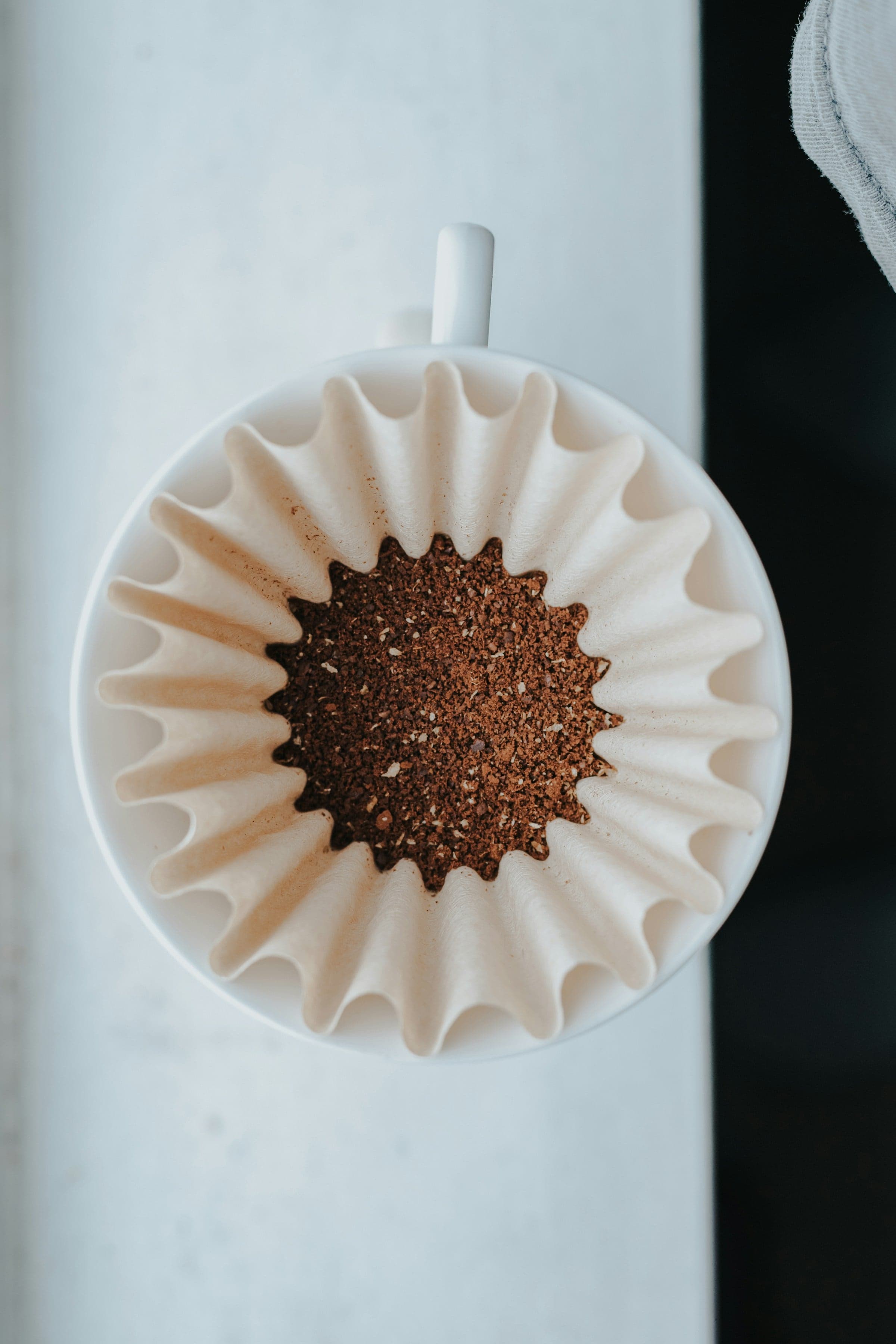 Ground coffee in a paper filter, from above